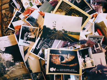 large collection of photographs piled together
